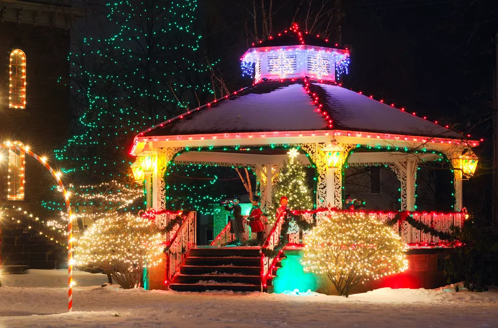A small-town Christmas display centered around the village gazebo